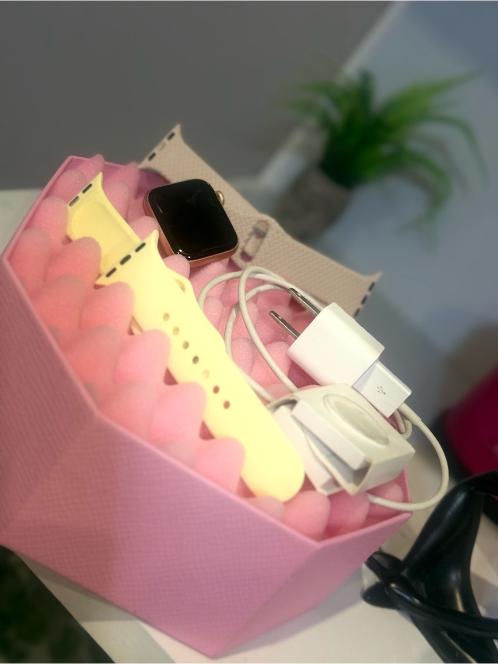 Smartwatch with Yellow Band and Charging Accessories